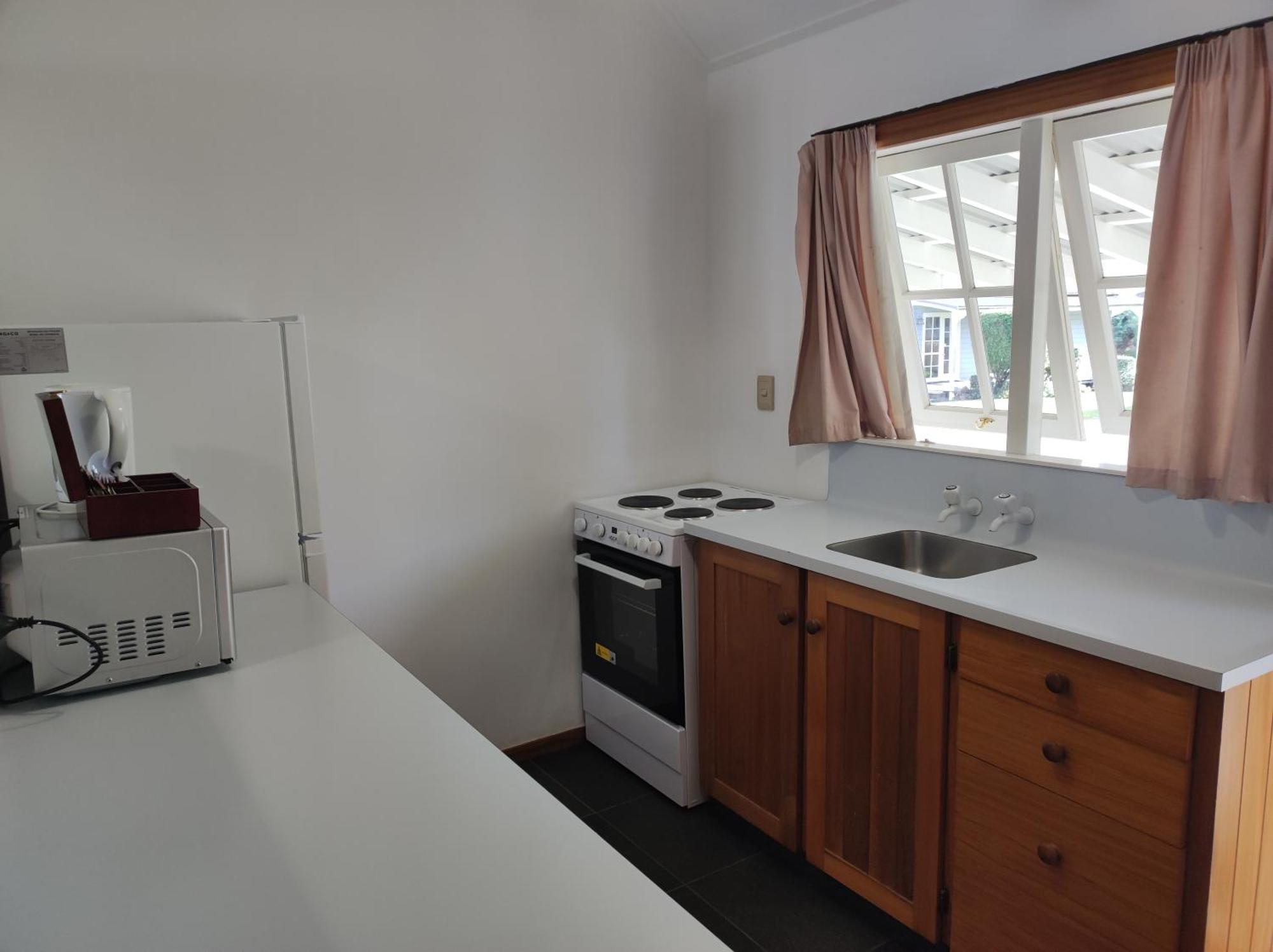 Huka Falls Resort Taupo Kültér fotó A kitchen in a student flat